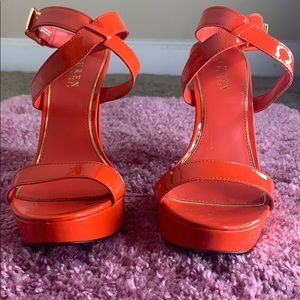 Orange Ralph Lauren shoes with minor scuffing